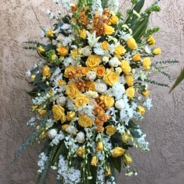 Large standing floral spray with yellow and white flowers