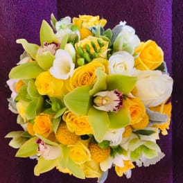 Yellow and white bouquet with orchids and roses