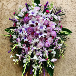 Large standing floral spray with white and purple flowers