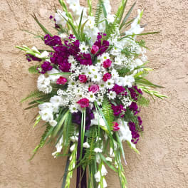 Tall standing floral spray with white and purple flowers