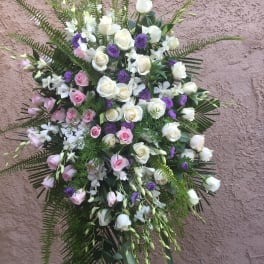 Standing floral spray with white and pink roses and purple accents