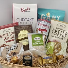 Basket of assorted cookies, candies, and snack packs