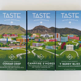 Three boxes of artisan chocolate with illustrated campus scenes