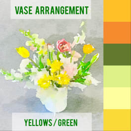 Yellow and white flowers arranged in a white vase