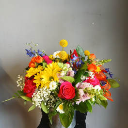 Colorful mixed bouquet in a ribbed metal container