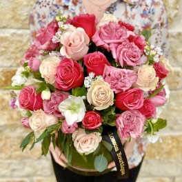 Bouquet of pink and cream roses in a glass vase