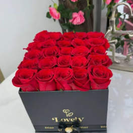 Box of red roses with a black ribbon