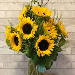 Sunflower arrangement in a clear glass vase