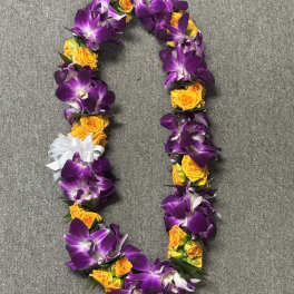 Purple orchid and yellow rose lei with a white ribbon bow