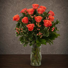 Coral rose bouquet in a clear glass vase