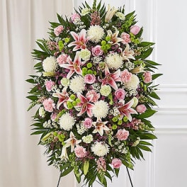 Standing floral spray with pink lilies, roses, and white mums