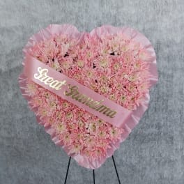 Heart-shaped pink chrysanthemum arrangement with a "Great Grandma" sash