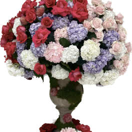 Large bouquet of roses and hydrangeas in a pedestal vase