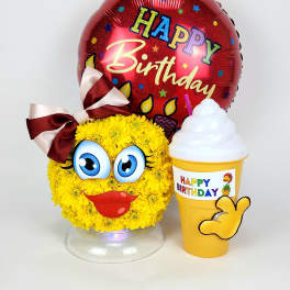 Yellow flower face arrangement with a birthday balloon and drink cup