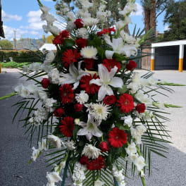 Tall standing floral spray with red and white flowers