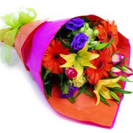 Bright mixed bouquet wrapped in pink and orange paper