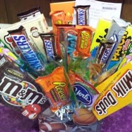 Assorted candy bars arranged in a gift basket