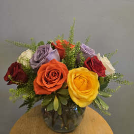 Colorful rose bouquet in a glass vase