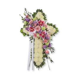 Cross-shaped floral spray with pink roses and lilies