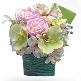 Pink roses and white alstroemeria in a teal textured container