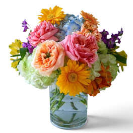Colorful mixed bouquet in a clear glass vase