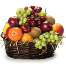 Fruit basket with grapes, apples, pears, oranges, and kiwi