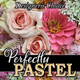 Pink and cream roses with a bright pink flower and white filler blooms