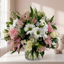 Pink and white mixed bouquet in a clear glass vase