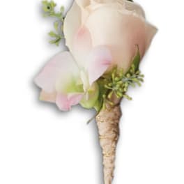 Small pale pink and white boutonniere with a wrapped stem