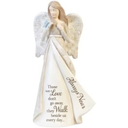 White angel figurine with a memorial message on the robe