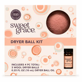 Boxed dryer ball kit with a wool ball and small oil bottle