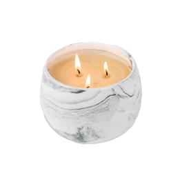 Three-wick candle in a white marbled glass holder