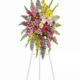 Tall standing floral spray with pink, yellow, and white flowers