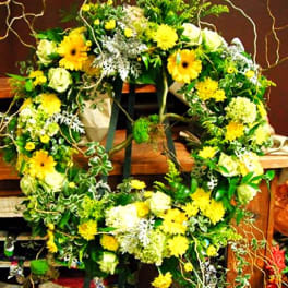 Large floral wreath with yellow and white flowers