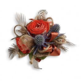 Small bouquet with red roses and dried grasses on a white background
