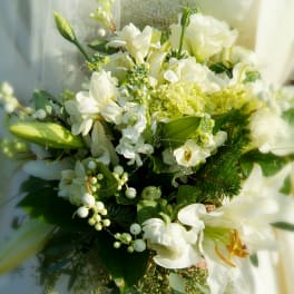 White floral bouquet with lilies and hydrangea