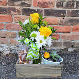 Yellow roses and white daisies in a wooden gift box with candy and a small succulent pot