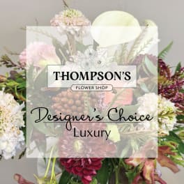 Mixed bouquet with pale pink, white, and burgundy flowers