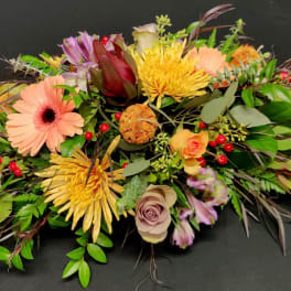 Long low medium autumn table centerpiece