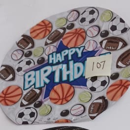 Round birthday balloon with sports balls and "Happy Birthday" text