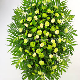 Large standing floral spray with white roses and green flowers