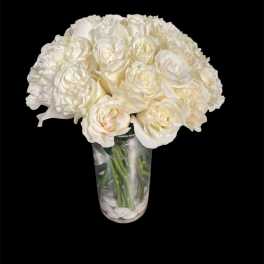 White rose bouquet in a clear glass vase