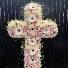 Cross-shaped floral arrangement with pink and white flowers