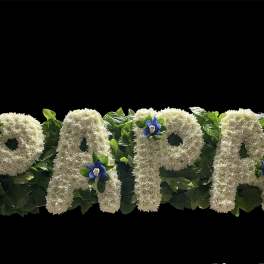 White floral letters spelling PAPA with blue accents