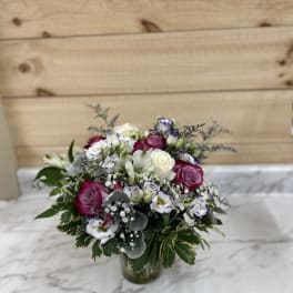 Bouquet of pink and white roses in a glass vase