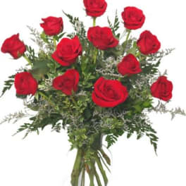 Bouquet of red roses in a clear glass vase