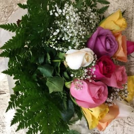 Bouquet of multicolored roses with white baby's breath