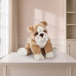Plush bulldog toy sitting on a white table