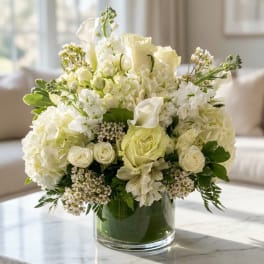 White floral arrangement in a clear glass vase