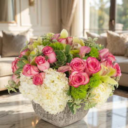 Pink roses and white hydrangeas in a textured vase